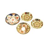 A pair of Royal Crown Derby Imari pattern saucers, each of circular form, 11cm diameter, a similar p