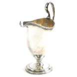 A George III silver helmet shaped cream cup, by Robert and David Hennell, with a reeded border and h