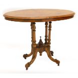A Victorian walnut occasional table, the circular quarter veneered top with inlaid border on four tu