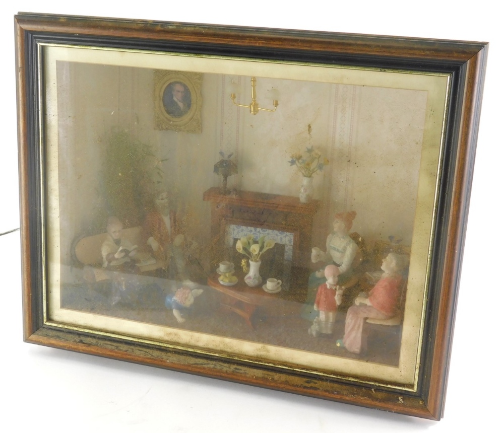 A cased electrical diorama, a family in a living room, with table and fire place, in glazed case wit