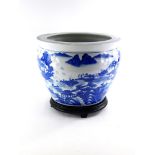 A Chinese porcelain jardiniere, decorated with buildings, mountains, coastline, etc., 34cm diameter.