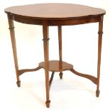 An Edwardian mahogany boxwood and chequer banded window table, the lobed top on square tapering legs