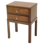 An early 20thC mahogany work or bedside table, with a moulded top above two drawers, each with mould