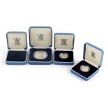 A 1989 silver proof one pound coin, a 1991 silver proof one pound coin, and 1990 silver proof crown,