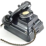 An ATM black Bakelite telephone, number L11186B9, 16cm wide. (AF)