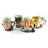 Four Royal Doulton character jugs, the poacher, Sairey Gamp, John Peel and Veteran Motorist.