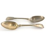 A George III silver tablespoon, initial fiddle back, plain bowl, London 1815, 23cm wide, and another