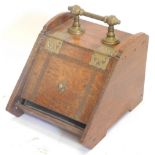 A late 19thC oak aesthetic movement coal box, with brass mounts, 31cm wide. (AF)