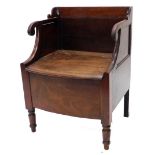 A 19thC mahogany commode, the raised back, scroll carved arm supports above a hinged seat, enclosing