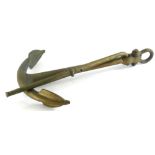 A 20thC brass ships anchor, typical form with articulated section, the main body, 62cm high.
