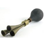 A vintage brass car horn, with rubber orb end and three trumpets, 38cm wide.