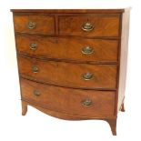 A Victorian mahogany bowfronted chest of drawers, with two short, three long drawers, each with oval