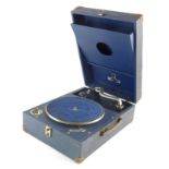 A vintage mid 20thC table top record player, impressed leather case with articulated chrome arm and