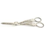 A pair of early 20thC silver plated grape scissors, heavily cut with elaborate handles and plain bla