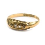 A three white stone gypsy set ring in 18ct gold, 1.9g all in.