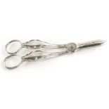 A pair of Georgian style Elizabeth II silver grape scissors, each with plain ends and shaped handles