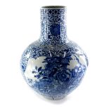 A late Chinese blue and white porcelain bottle shaped vase, decorated with birds, butterflies, flowe