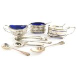 A George V silver two piece condiment set, comprising mustard pot, 10cm wide and open salt with blue