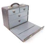 A unusual leather travelling tool or instrument case, the hinged lid enclosing two short and two lon