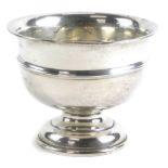 An Edward VII silver pedestal bowl, of plain form with a central raised rim, Chester 1908, 12cm high