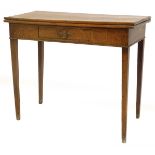 An early 19thC oak tea table, the rectangular top with a frieze drawer on square tapering legs, 86cm