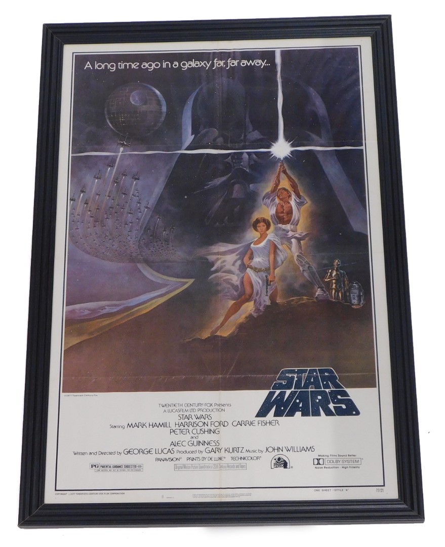 A 1977 Star Wars poster, copyrighted, one sheet-style A number 77/21, framed and glazed, 104cm x 68c