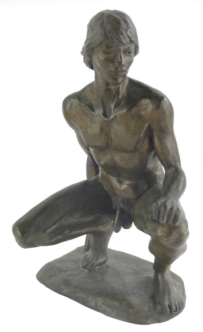 A bronzed finish resin sculpture, after Neil Godfrey, depicting a male nude crouching, 27cm high.