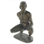 A bronzed finish resin sculpture, after Neil Godfrey, depicting a male nude crouching, 27cm high.