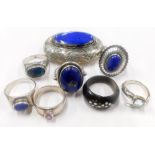 A group of silver jewellery, to include a silver locket, group of silver dress rings, each set with