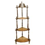 A Victorian walnut and marquetry four tier what not, on turned supports, 145cm high.