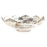 A George V silver dish, of flared form, partially pierced, on circular foot, Sheffield 1920, 23cm wi