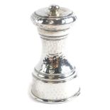 A George V silver pepper grinder, with hammered decoration, London 1911, 9cm high.