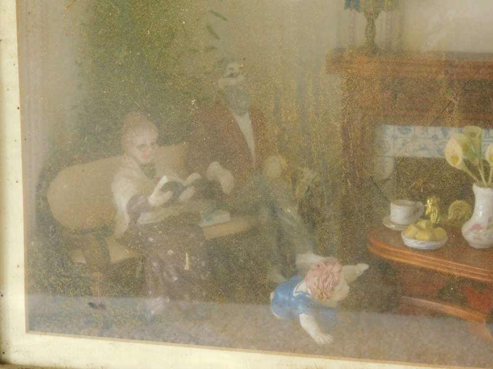 A cased electrical diorama, a family in a living room, with table and fire place, in glazed case wit - Image 3 of 3