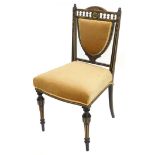 A Victorian ebonised and parcel gilt aesthetic movement side chair, with a padded back and seat on t