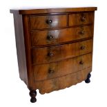 A Victorian mahogany bowfronted chest of drawers, with a plain top above two short and three long dr