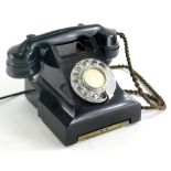 A GRO 164 black Bakelite telephone, numbered 332CBFWR57/2, 17cm wide. (AF)
