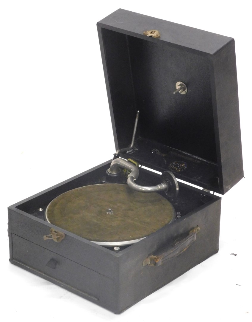 A wind up gramophone, in black wood and canvas case, maker's label indistinct, HMV stylist, etc., 34