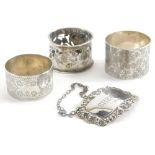 A collection of small silver, various silver napkin rings, to include one decorated profusely with t