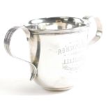 An early 20thC Irish silver loving cup, of plain form with engraved inscription .P.O.H.W. Phibbs fro