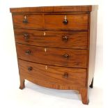 A Victorian mahogany bow fronted chest of drawers, with panel feet, above two short and three long d
