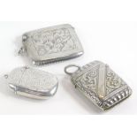 Two silver Vesta cases, Birmingham 1919 and 1898, and a silver plated example, weighable silver 1½oz