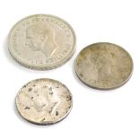 A 1951 crown, a 1961 half dollar and 1963 half crown.