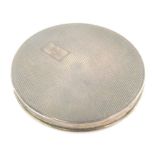 A mid 20thC silver Art Deco powder compact, of circular form, partially engine turned, with vacant c