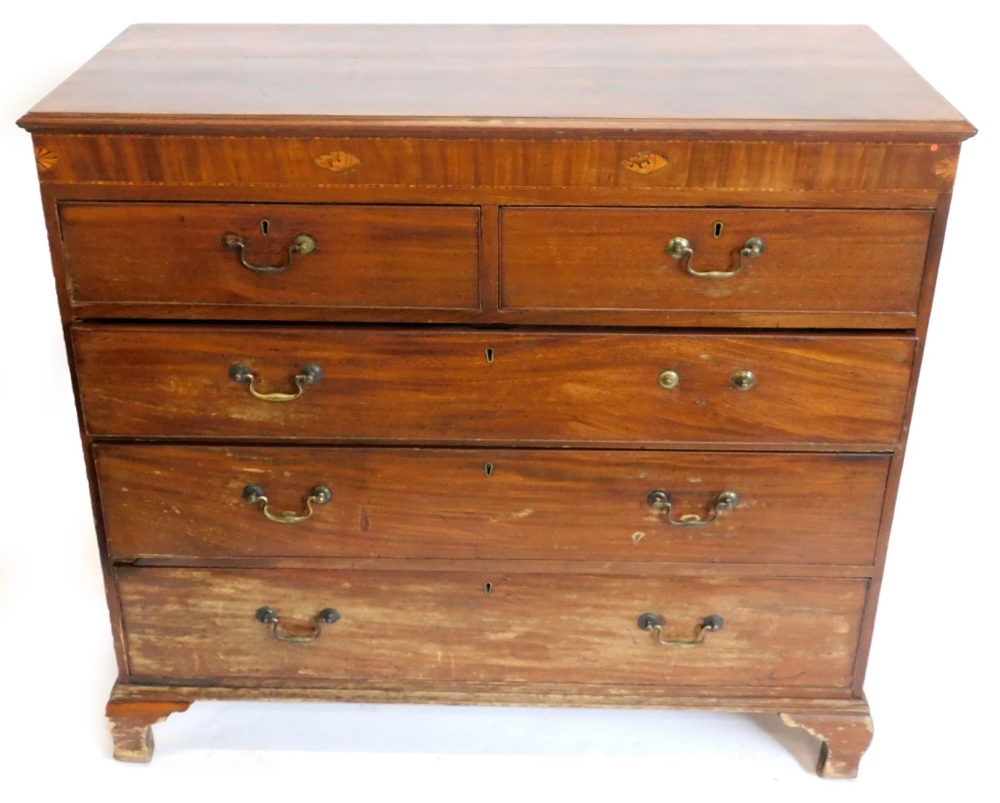 A early 19thC mahogany chest of drawers, the top with a moulded edge above a frieze inlaid with shel