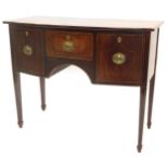 A George III mahogany, boxwood strung and feather banded small sideboard, with a bow fronted top, ab