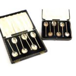 Two cased sets of six silver teaspoons, both with seal type handles, Sheffield 1931, Birmingham 1951