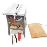 A mains powered table saw, with some accessories.