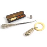 A collection of small silver and silver plated items, comprising a silver thimble, London 1900, a ci