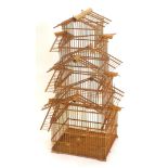 A Oriental bamboo bird cage, of pagoda form, 86cm high.