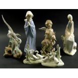 A Lladro porcelain figure of a putto, (AF), figure of a fawn and various Nao figurines. (7)